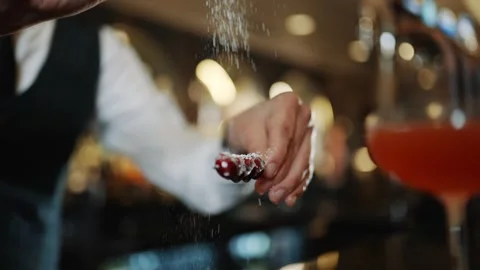 A bartender is making a drink with a shaker and a glass Stock-Footage 295996282