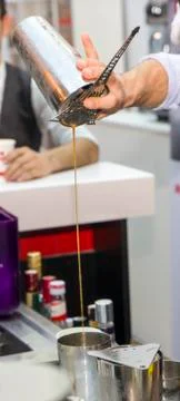 Bartender is making drinks behind the bar Stock Photos