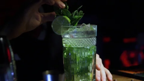 Bartender making a fresh and cold sweet  mojito Stock Footage 102833715