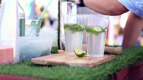 Bartender making fresh lemonade on street food festivale Stock Footage 77262036