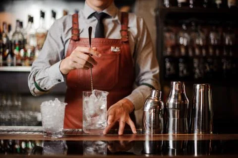 Bartender is making make a cocktail with ice 스톡 사진