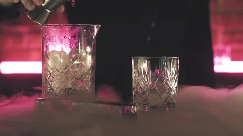 Bartender making Negroni cocktail at the bar Stock Footage 125280083
