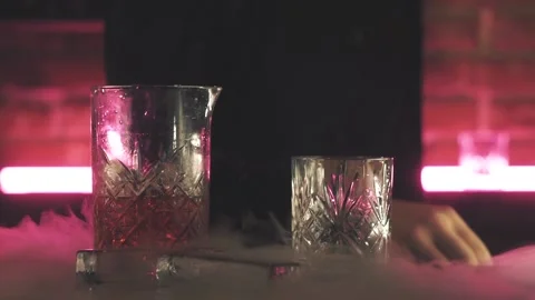 Bartender making Negroni cocktail at the bar Stock Footage 125280569