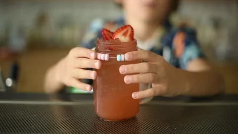 Bartender Making a Pink Lemonade Drink at a Bar Stock Footage 278740129