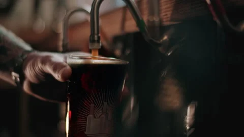 Bartender making top-ups on short measure pints Stock Footage 132004817