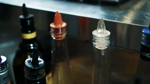 Bartender man is taking bottle of drink in trendy bar. Stock Footage 87324053