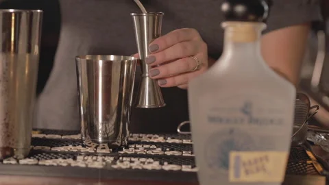 A bartender measures out tequila. Stock Footage 148092422