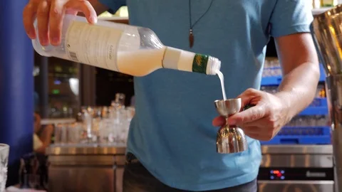 Bartender measuring alcohol Stock Footage 92464675