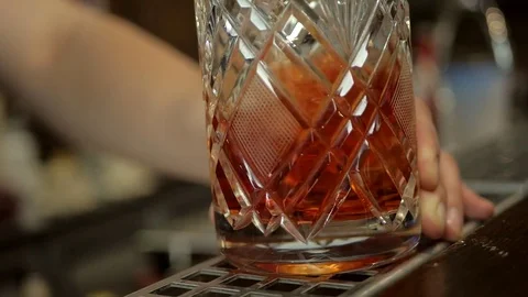 Bartender mixes a cocktail with a spoon, slow motion Stock Footage 75706997
