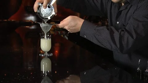 Bartender mixes fancy drink Stock Footage 20462443