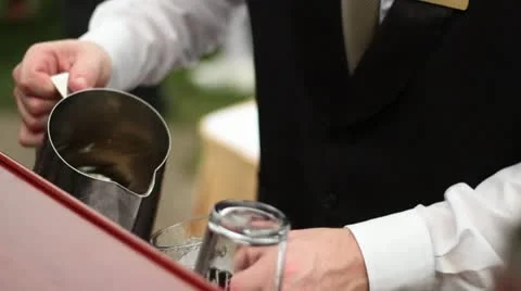 Bartender mixing and serving drinks at bar cu Vídeo Stock 18008677