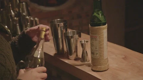 Bartender Mixing Cocktail with Spirits and Shakers at Bar Counter in Beijing Stock Footage 345746540