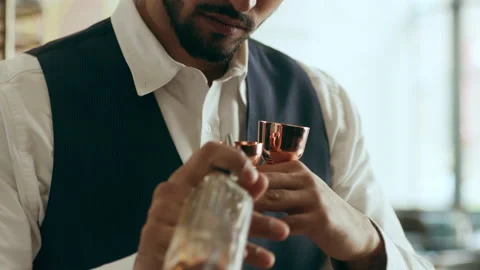 Bartender mixologist adding ingredients into shaker making classic Daiquiri cock Stock Footage 199457903