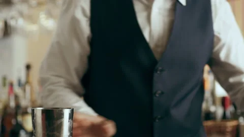 Bartender mixologist pouring cocktail using strainer to make classic Daiquiri co Stock Footage 199463348