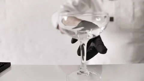 Bartender Mixologist Puts Empty Cocktail Glass on Bar Counter Video stock 129421018