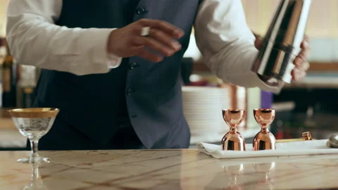 Bartender mixologist tossing shaker and making classic Daiquiri cocktail in a be Stock Footage 199455689