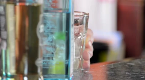 Bartender Muddling Fruit with Ice in Bar Glass Stock Footage 58173188
