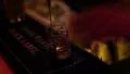 Bartender in night club is serving alcohol drinks HD Footage