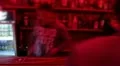Bartender in night club is serving alcohol drinks, vodka cocktails HD Footage
