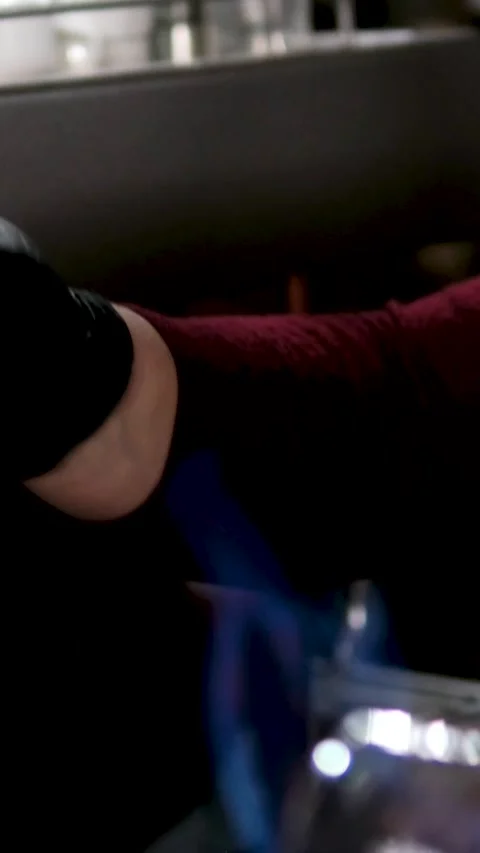 Bartender performing flair bartending with bottles and fireworks in slow motion Stock Footage 323524919