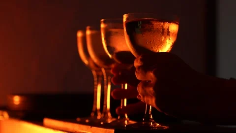 Bartender Picking Up Cocktail in Dramatic Low Light Stock Footage 318001629