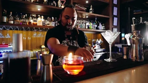 Bartender with piercings and dreadlocks working Stock Footage 65397601