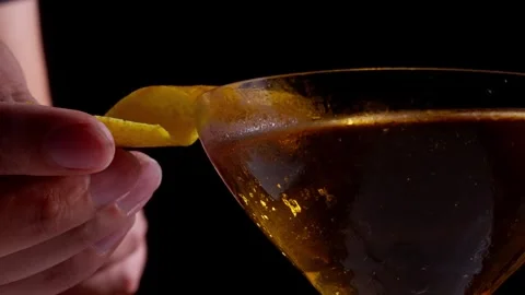 Bartender Placing Citrus Peel Garnish on Cocktail Rim Stock Footage 337862429