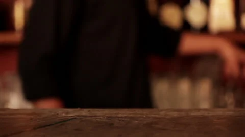 Bartender placing ice cubes in cocktail glass Stock Footage 63306113