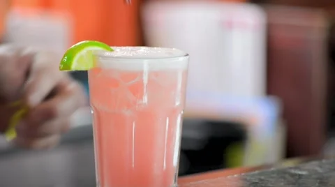 Bartender Placing Straw and Plastic Mermaid on Pink Cocktail Rim Video stock 58173261