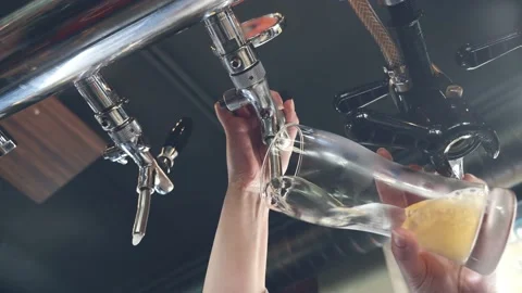 Bartender pour draft beer into glass close up Stock Footage 238724793