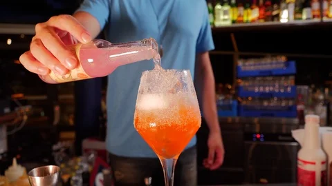 Bartender pouring alcohol and making cocktails Stock Footage 93348865