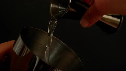 Bartender pouring alcohol into shaker close up 4K Stock Footage 172210888