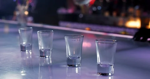 Bartender Pouring Alcohol In Shot Glasses In The Disco Stock Footage 108918656