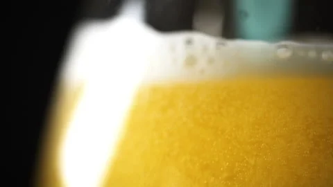 Bartender pouring beer, Carbonation bubbles, Dolly around glass, Macro Stock Footage 140270814