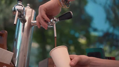 Bartender Pouring Beer From Tap In Eco Paper Cup Video stock 155357516