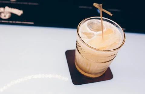 Bartender pouring Cocktail on a bar counter alcoholic drink in nightclub Stock Photos