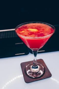 Bartender pouring Cocktail on a bar counter alcoholic drink in nightclub Stock Photos