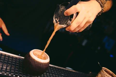 Bartender pouring Cocktail on a bar counter alcoholic drink in nightclub Stock Photos