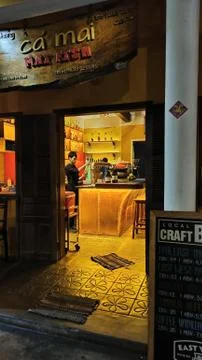Bartender is pouring a craft beer at night view outside Stock Photos