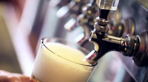 Bartender pouring draft beer in the bar. Stock Footage 57405766