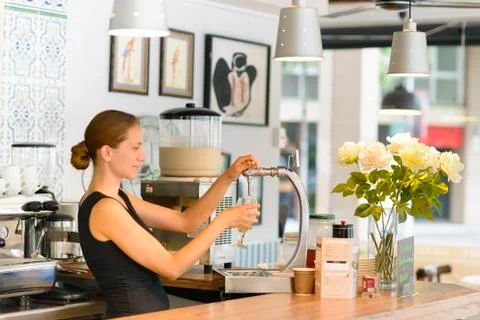 Bartender pouring draft beer Stock Photos