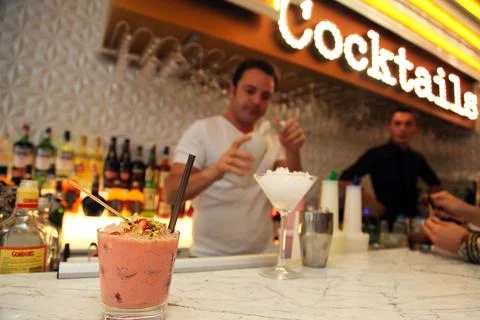 Bartender is pouring a drink Stock Photos
