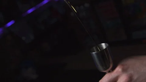 Bartender pouring drink into tin Stock Footage 90122914