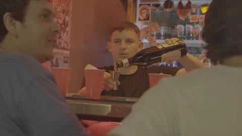 A bartender pouring drinks and customers in Buenos Aires, Argentina Stock Footage 345138165