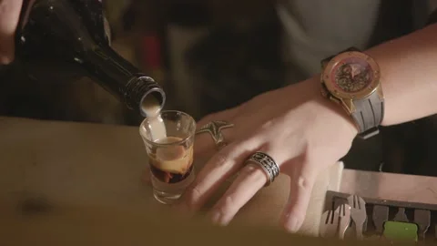 Bartender Pouring Layered Shot Drink at Bar Counter in Beijing, China Stock Footage 345751951