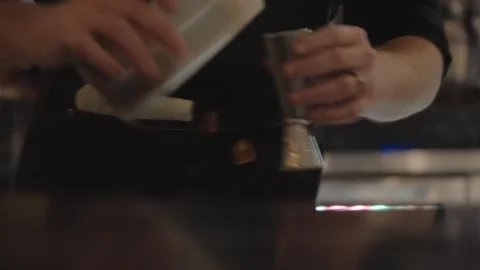 Bartender Pouring Simple Syrup into Jigger at Luxury Hotel Bar | 4K Footage Stock Footage 334838956