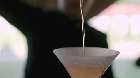 Bartender pouring smooth cocktail Stock Footage 139423426