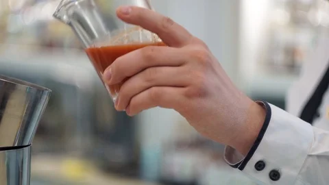 Bartender pouring tomato juice into a shaker Stock Footage 101967448