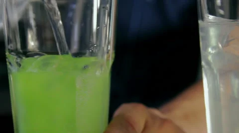 Bartender pouring two glasses of ice and sirup wtih tonic. dolly shot. Stock Footage 41775146