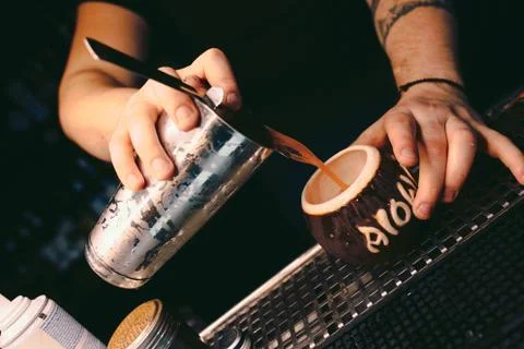 Bartender pouring using strainer White healthy Cocktail drink on a bar counte Stock Photos